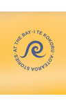 AT THE BAY | I TE KOKORU logo