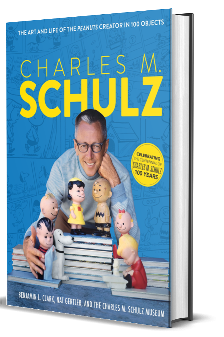 Book cover of Charles M. Schulz: The Art and Life of the Peanuts Creator in 100 Objects by Benjamin L. Clark